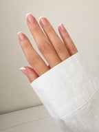 Classic French press-on nails on hand