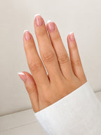 Classic French press-on nails on hand