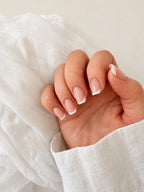 Classic French press-on nails on hand
